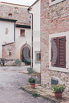 Detail of a italian house with flowers on the porch