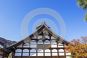 Detail on japanese temple roof against blue sky