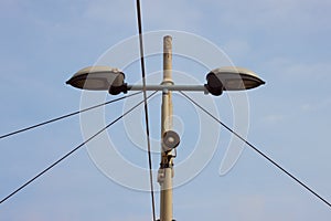 Detail of a lamppost with a small loudspeaker