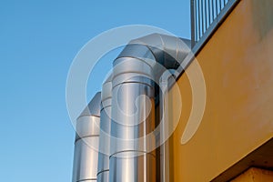 detail of a large luminous steel tube, ventilation system pipes, air conditioning and ventilation system.