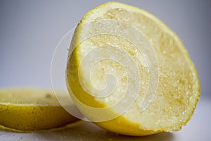 A detail of a lemon cut in a half covered in sugar