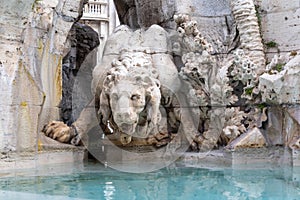 Detail of lion statue at famous Fountain of the Four Rivers in Rome. Italy