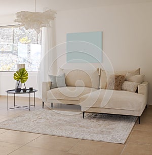 Detail of the living room with a light fabric sofa with cushions and a small table with plants next to it. Above the sofa there is