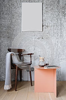 Detail of loft interior in room with wooden chair and table