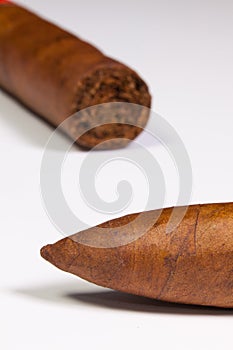 Detail of luxury Cuban cigars on the white table photo
