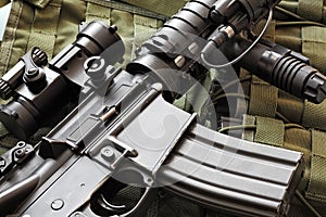 Detail of M4A1 (AR-15) carbine and tactical vest