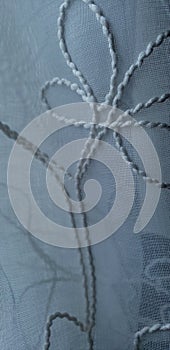 Detail macro of white embroided flower