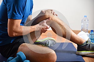 Detail of man doing sports with knee pain