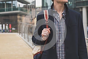 Detail of a man posing in the city streets