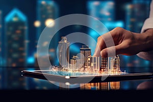 Detail of A man using digital tablet with a modern buildings hologram on it. Real estate business and building technology concept