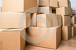 Detail of many cardboard boxes full of household items during a move