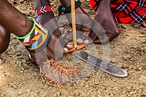 Detail of Masai men making a fire, Ken