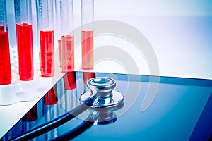 Detail of medical stethoscope on modern digital tablet pc in laboratory