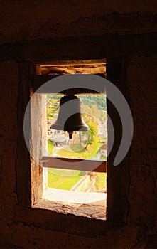 Detail of medieval Predjama Castle. Privat church of the owners of the castle. Window with the church bell.