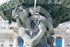 Detail of mermaid of fountain at Rossio Square Lisbon