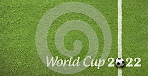 Detail message on the grass announcing world cup football 2022