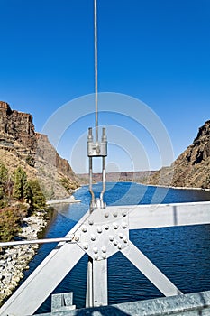 Detail of the metal girders and cable of the bridge over the Deschutes River at Cove Palisades State Park, Oregon, USA