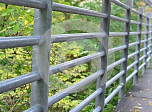 Detail of a metal railing on a bridge, the city of Horn