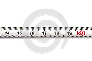 Detail of a metal ruler on white background