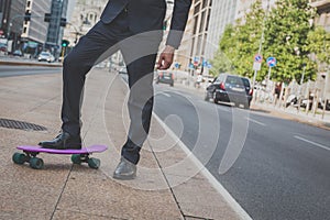 Detail of a model posing with his skateboard