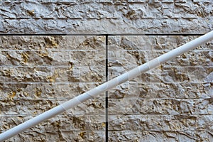 Detail of modern achitecture stone facade with handrail