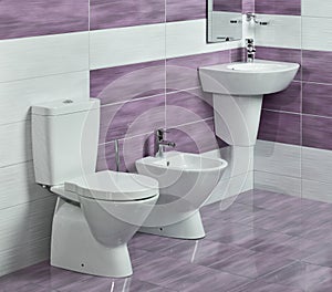 Detail of modern bathroom with sink, toilet and bidet