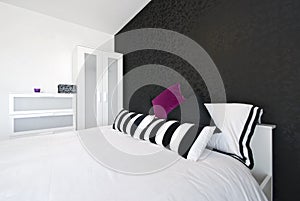 Detail of a modern bedroom with king size bed photo