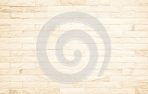 Detail of modern cream brick wall background photo. Brown light brick wall texture background for stone tile block painted in