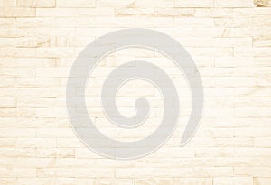 Detail of modern cream brick wall background photo. Brown light brick wall texture background for stone tile block painted in