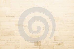 Detail of modern cream brick wall background photo. Brown light brick wall texture background for stone tile block painted in