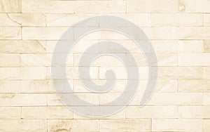 Detail of modern cream brick wall background photo. Brown light brick wall texture background for stone tile block painted in