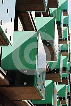 Detail of modern green glass balcony during sunny day