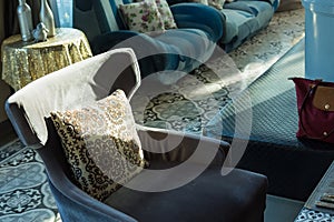 Detail of modern living room with beige pillow cushions on sofa