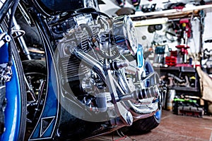 Detail on a modern motorcycle in the workshope. Motorcycle Exhaust. selective focus photo