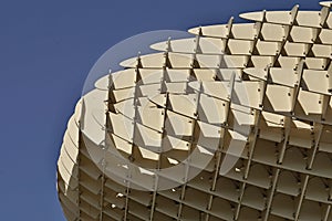 Detail of a modern roof of a contemporary building in Sevilla Spain made of wooden and iron boards as a symbol of futuristic arc