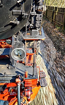 Detail of a moving steam locomotive. Dynamics through motion blur