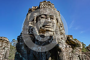 Detail Mural faces in the stone of Bayon belong angkor thom nearly angkor wat