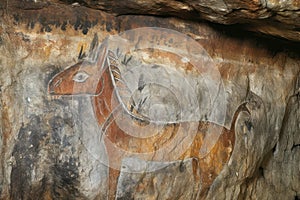 detail of a mythological creature in rock art