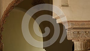 Detail of Nasrid arc and chapiter column in the Alcazaba, Malaga, Spain