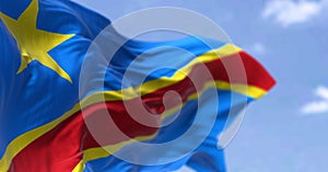 Detail of the national flag of the Democratic Republic of the Congo waving in the wind on a clear day