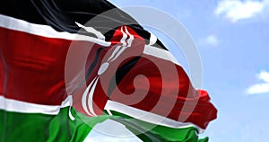 Detail of the national flag of Kenya waving in the wind on a clear day