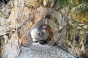 Detail of a natural cave on the beach photo