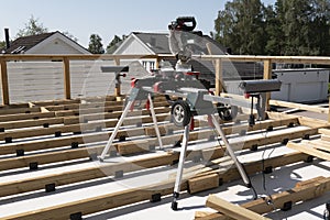 Detail of new terrasse on house with cutting wood machine