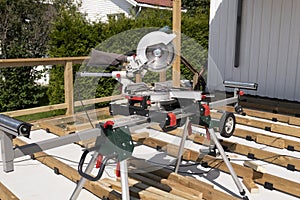 Detail of new terrasse on house with cutting wood machine