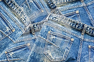 Detail of nice blue jeans on black background