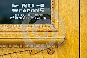 Detail of the No Weapons Notice on the Door of the Jefferson County Courthouse in Port Townsend, Washington, USA