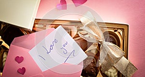 Detail of note with love message on box of chocolates