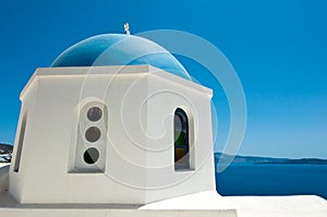 Detail of Oia church with blue cupola on the island of Thera (Santorini).