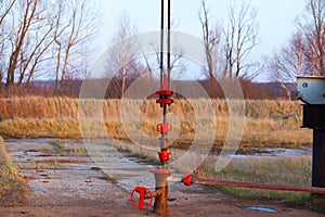 Detail of oil pipeline with valves in large oil refinery