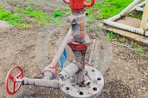 Detail of oil pipeline with valves in large oil refinery.